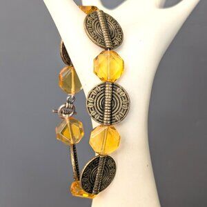 Honey colored glass beaded bracelet with antiqued gold disks